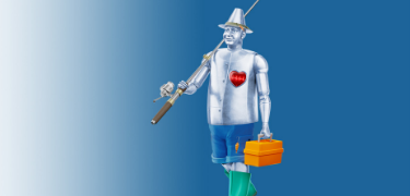 Man made of tin dressed for fishing, carrying a fishing rod and tackle box.